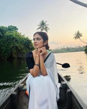 Stunning Malavika Mohanan in a White Cotton Saree with Black Borders and Black Blouse Photos 01