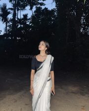 Stunning Malavika Mohanan in a White Cotton Saree with Black Borders and Black Blouse Photos 03