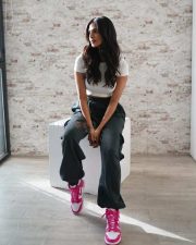 Stunning Malavika Mohanan wearing a White Crop Top and Cargo Joggers in a Pink Shoes Photos 02