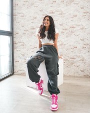 Stunning Malavika Mohanan wearing a White Crop Top and Cargo Joggers in a Pink Shoes Photos 03