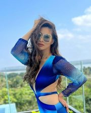 Stunning Raai Laxmi in a Deep V Long Neck One Piece High Wait Swimsuit Photos 01