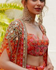 Stunning Rakul Preet Singh in a Orange and Pink Mehendi Lehenga Pictures 02