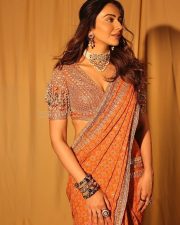 Stunning Rakul Preet Singh in an Orange Printed Embroidered Blouse with Embroidered Flat Saree Photos 01