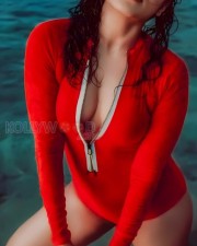 Stunning Rima Kallingal in a Red One Piece Swimsuit Pictures 04