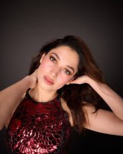 Stunning Tamannaah Bhatia in a Sleeveless Deep Wine Red Bodycon Dress Photos 01