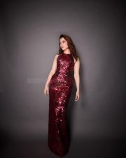 Stunning Tamannaah Bhatia in a Sleeveless Deep Wine Red Bodycon Dress Photos 02