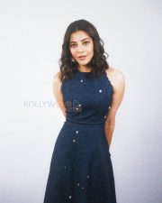 Stylish Actress Kajal Aggarwal in a Navy Blue Halter Scallop Dress Photos 02