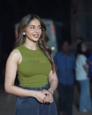Stylish Actress Rakul Preet Singh in a Olive Green Ribbed Top Denim Skirt Photos 02