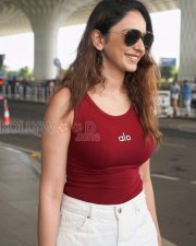 Stylish Actress Rakul Preet Singh in a Red Alo Ribbed Tank Top with White Jeans Photos 04