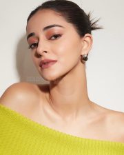 Stylish Ananya Panday in a Green Off Shoulder Knitted Blouse and Denim Jeans Photos 03