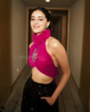 Stylish Ananya Panday in a Pink Turtleneck Crop Top with Black Glittering Pants Photos 01