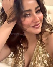 Stylish Hottie Neha Sharma in a Golden Deep Plunge Top Pictures 02