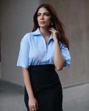 Stylish Malavika Mohanan in a Black Pencil Skirt and Sky Blue Shirt Photos 01 Stylish Malavika Mohanan in a Black Pencil Skirt and Sky Blue Shirt Photos 01