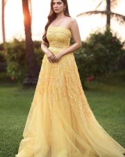Stylish Malavika Mohanan in a Yellow Long Gown Pictures 02 Stylish Malavika Mohanan in a Yellow Long Gown Pictures 02