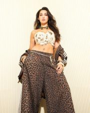 Stylish Nora Fatehi in a White Bralette and Animal Printed Pants Photos 04