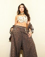 Stylish Nora Fatehi in a White Bralette and Animal Printed Pants Photos 04