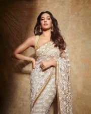 Stylish Nora Fatehi in an Embroidered White Sheer Saree with Matching Blouse Pictures 02