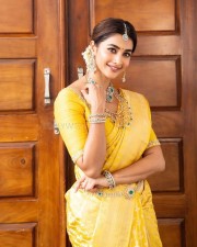 Stylish Pooja Hegde in an Ethnic Bridal Yellow Saree Photos 01