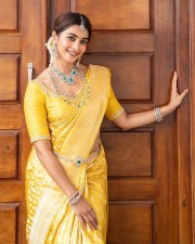 Stylish Pooja Hegde in an Ethnic Bridal Yellow Saree Photos 04