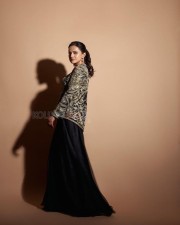 Stylish Shraddha Srinath Cleavage in a Black Straight Neck Maxi Dress Photos 02