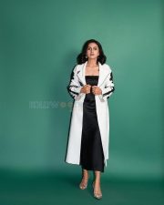 Stylish Shraddha Srinath in a Black Maxi Dress with a White Floral Courts Photos 01