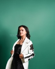 Stylish Shraddha Srinath in a Black Maxi Dress with a White Floral Courts Photos 03