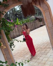 Tamil Beauty Yashika Aannand in a Red Open Back Midi Dress Pictures 03