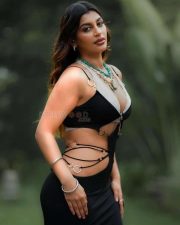Tamil Glamour Actress Yashika Aannand in a Black Cutout Maxi Dress over a White Lace Bralette Photos 01