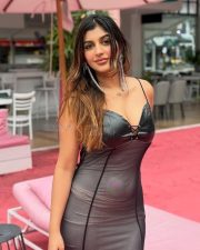 Tamil Glamour Actress Yashika Aannand in a Black Faux Leather and Mesh Corset Style Bodycon Dress Photos 02
