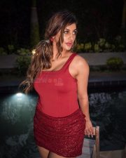 Tamil Glamour Actress Yashika Aannand in a Deep Red Corset Bodysuit with a Red Sequined Mini Skirt Pictures 07