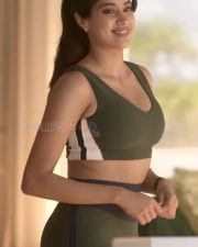 Tempting Janhvi Kapoor in a Dark Green Scoop Neck Sports Bra with a Matching High Waisted Leggings Photos 02