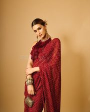 Tere Ishk Mein Actress Kriti Sanon in a Fiery Red Printed Pre Draped Saree with a High Collar Backless Blouse Photos 06