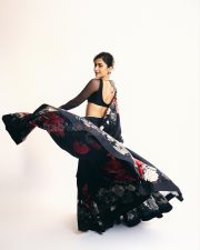 Thamma Actress Rashmika Mandanna in a Black Floral Lehenga with a Sheer Full Sleeve Blouse Pictures 02