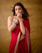 The India Story Actress Kajal Aggarwal in a Red Embroidered Saree with a Matching Sleeveless Blouse Photos 02