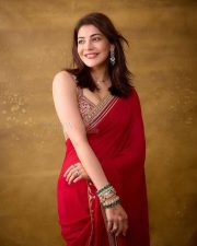 The India Story Actress Kajal Aggarwal in a Red Embroidered Saree with a Matching Sleeveless Blouse Photos 04