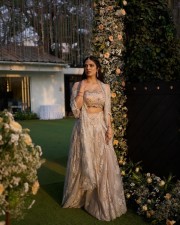 The Raja Saab Heroine Malavika Mohanan in a Cream Lehenga with an Off Shoulder Top and Midi Coat Dupatta Photos 01