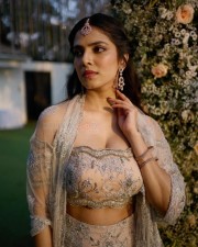 The Raja Saab Heroine Malavika Mohanan in a Cream Lehenga with an Off Shoulder Top and Midi Coat Dupatta Photos 02 The Raja Saab Heroine Malavika Mohanan in a Cream Lehenga with an Off Shoulder Top and Midi Coat Dupatta Photos 02