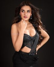 The RajaSaab Heroine Nidhhi Agerwal in a Black Pre Draped Saree with a Structured One Shoulder Corset Blouse Photos 07