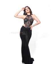 The RajaSaab Heroine Nidhhi Agerwal in a Bold Black Lace Sheer Corset Halter Top with a Low Rise Maxi Skirt Photos 07