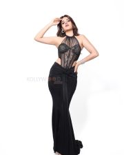 The RajaSaab Heroine Nidhhi Agerwal in a Bold Black Lace Sheer Corset Halter Top with a Low Rise Maxi Skirt Photos 07