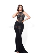 The RajaSaab Heroine Nidhhi Agerwal in a Bold Black Lace Sheer Corset Halter Top with a Low Rise Maxi Skirt Photos 08
