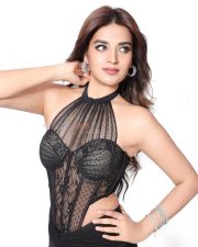 The RajaSaab Heroine Nidhhi Agerwal in a Bold Black Lace Sheer Corset Halter Top with a Low Rise Maxi Skirt Photos 10