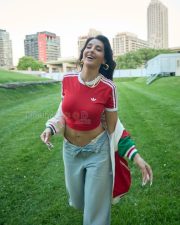 Trendsetting Actress Norah Fatehi in a Red Adidas Crop Top And Grey Track Pants Photos 02