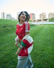 Trendsetting Actress Norah Fatehi in a Red Adidas Crop Top And Grey Track Pants Photos 03