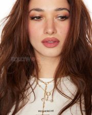 Trendsetting Actress Tamannaah Bhatia in a White Graphic Knotted Crop Tee Photos 04