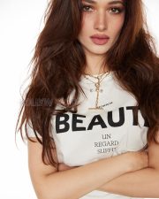 Trendsetting Actress Tamannaah Bhatia in a White Graphic Knotted Crop Tee Photos 09