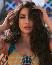 Vibrant Actress Nora Fatehi in a Multicolor Abstract Polka Dot Bodysuit Photos 02