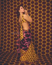 Vibrant Actress Tamannaah Bhatia in a yellow and pink geometric patterned crop top Photos 04