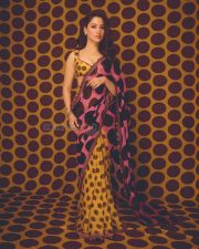 Vibrant Actress Tamannaah Bhatia in a yellow and pink geometric patterned crop top Photos 05