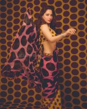 Vibrant Actress Tamannaah Bhatia in a yellow and pink geometric patterned crop top Photos 06